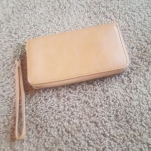 Tan multi compartment wallet.